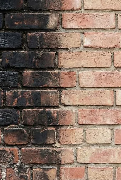 Laser fire damage restoration — non-abrasive soot and smoke removal from brick, concrete and wood surfaces